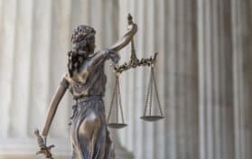 The statue of justice Themis or Justitia the blindfolded goddess