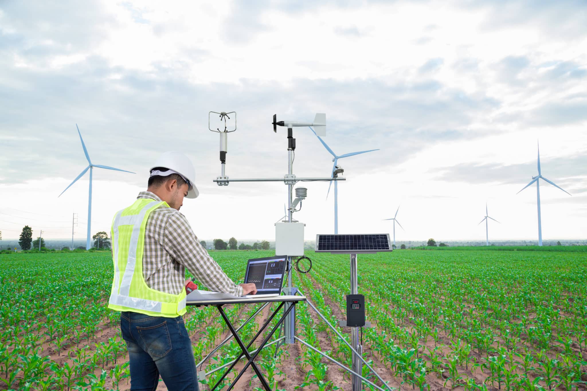 Engineer using tablet computer collect data with meteorological