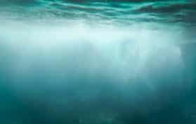 bubbles floating in clear turquoise ocean