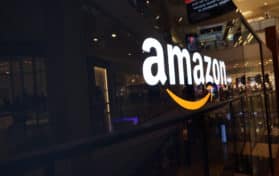 Amazon logo on black shiny wall