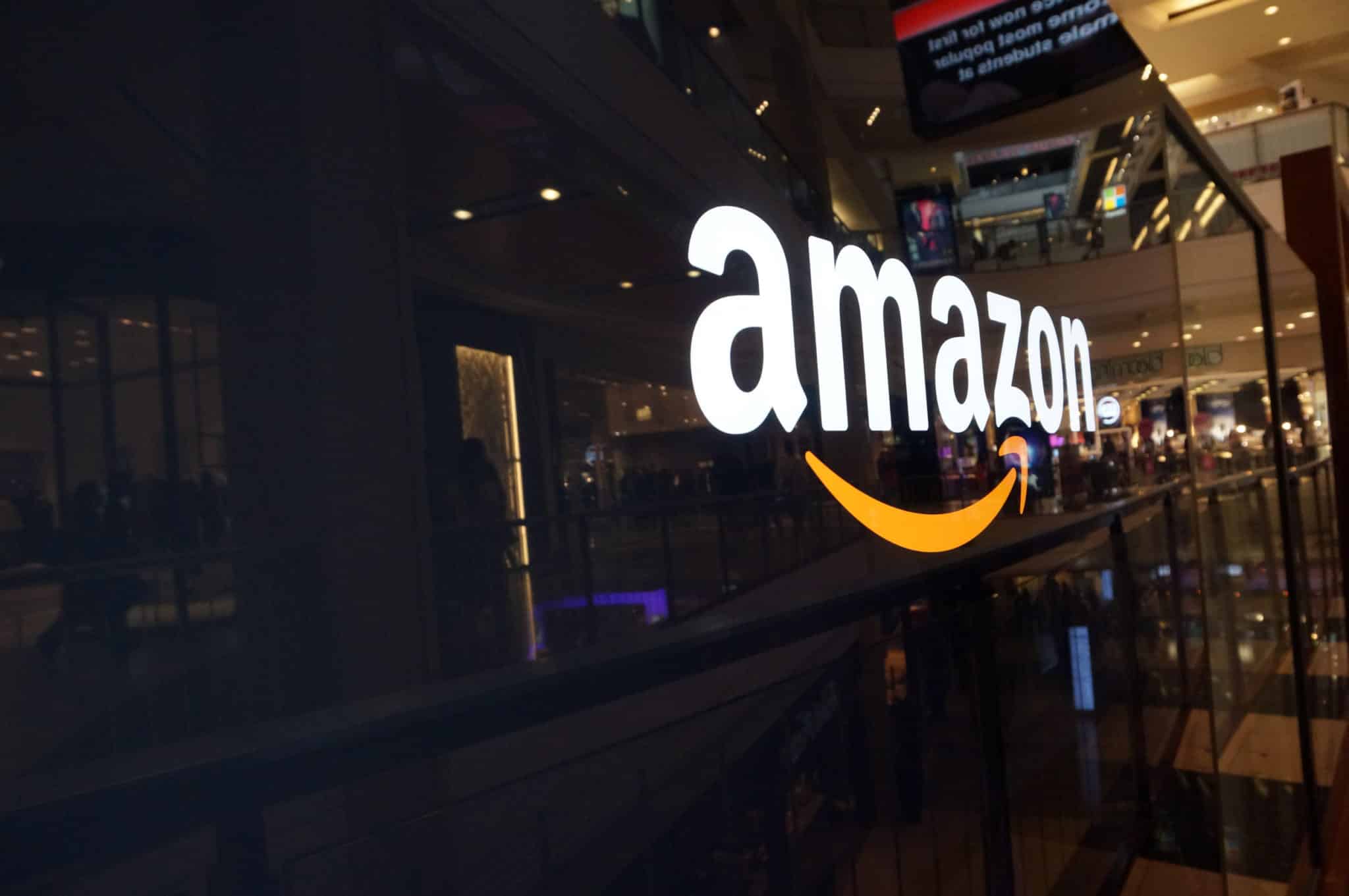 Amazon logo on black shiny wall