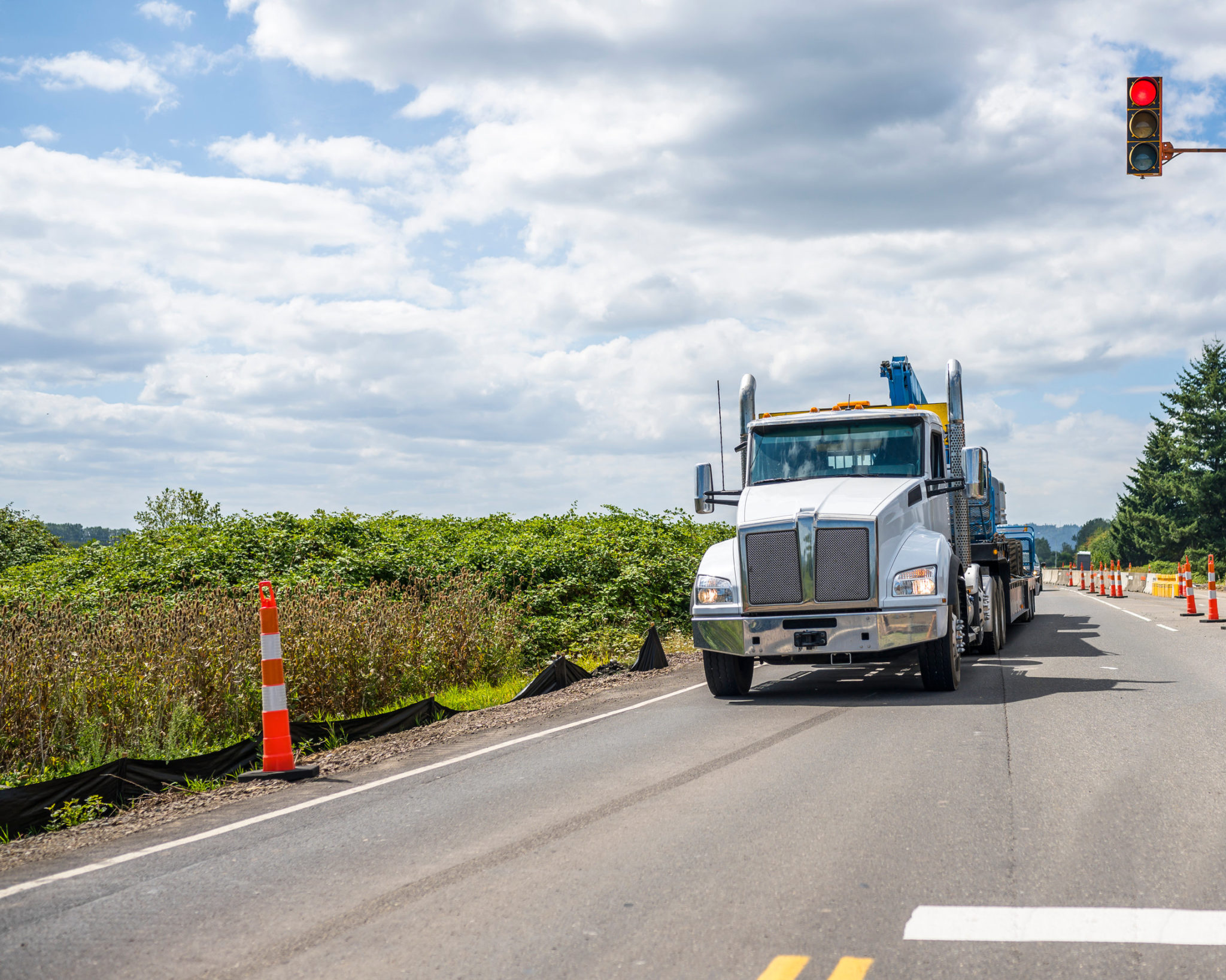 Big rig semi truck transporting heavy equipment