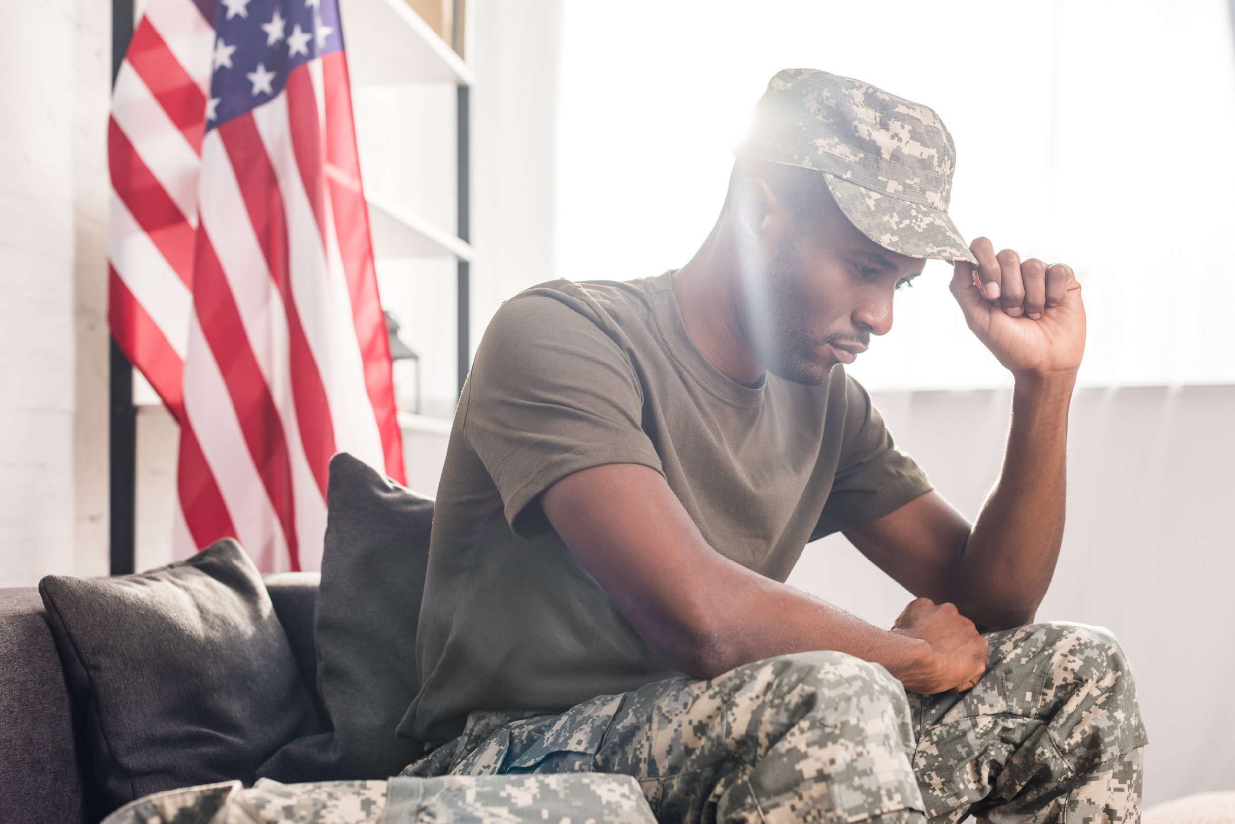 - This Nation African american soldier in camouflage clothes sitting on sofa