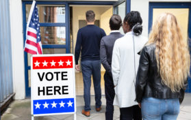 People Standing Outside Waiting to Vote