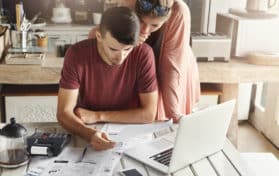 young couple filing taxes