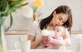 mom feeding baby