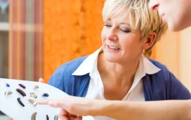 woman looking at hearing aids