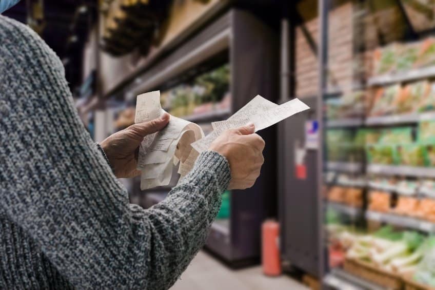 man looking at receipts